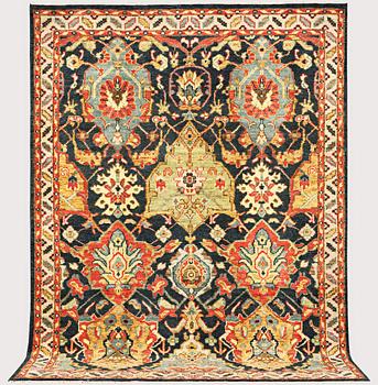 An oriental carpet with Mamluk design, a. 331 x 274 cm.