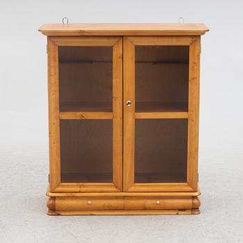 A small wall cabinet, around 1900.