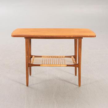 A teak and rattan 1960s coffee table.