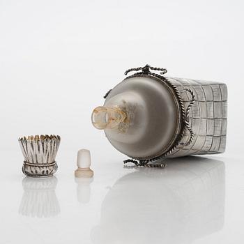 A silver and glass bottle with eight silver charka, maker marks of Pyotr Yermolajevich Davidov, Saint Petersburg, 1884.