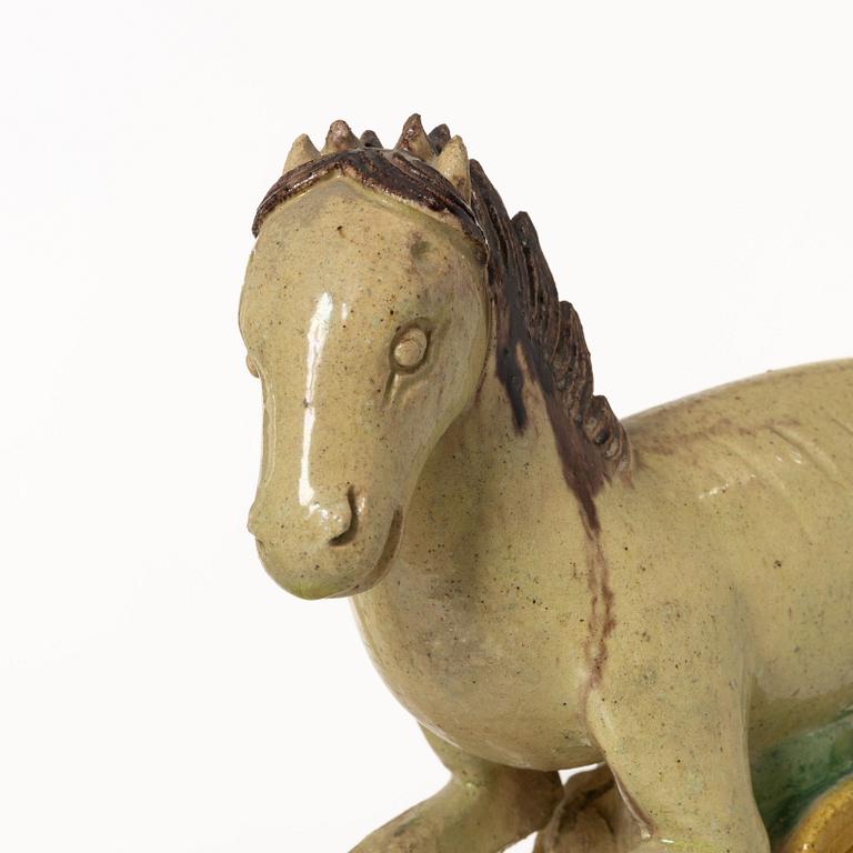 A set of two green and yellow glazed roof tiles figures of flying horses, Qing dynasty.