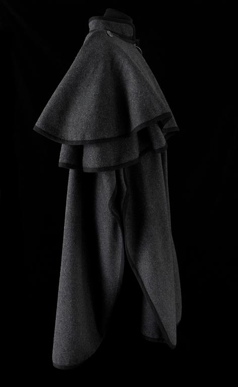 A 1970s grey wool cape by Yves Saint Laurent.