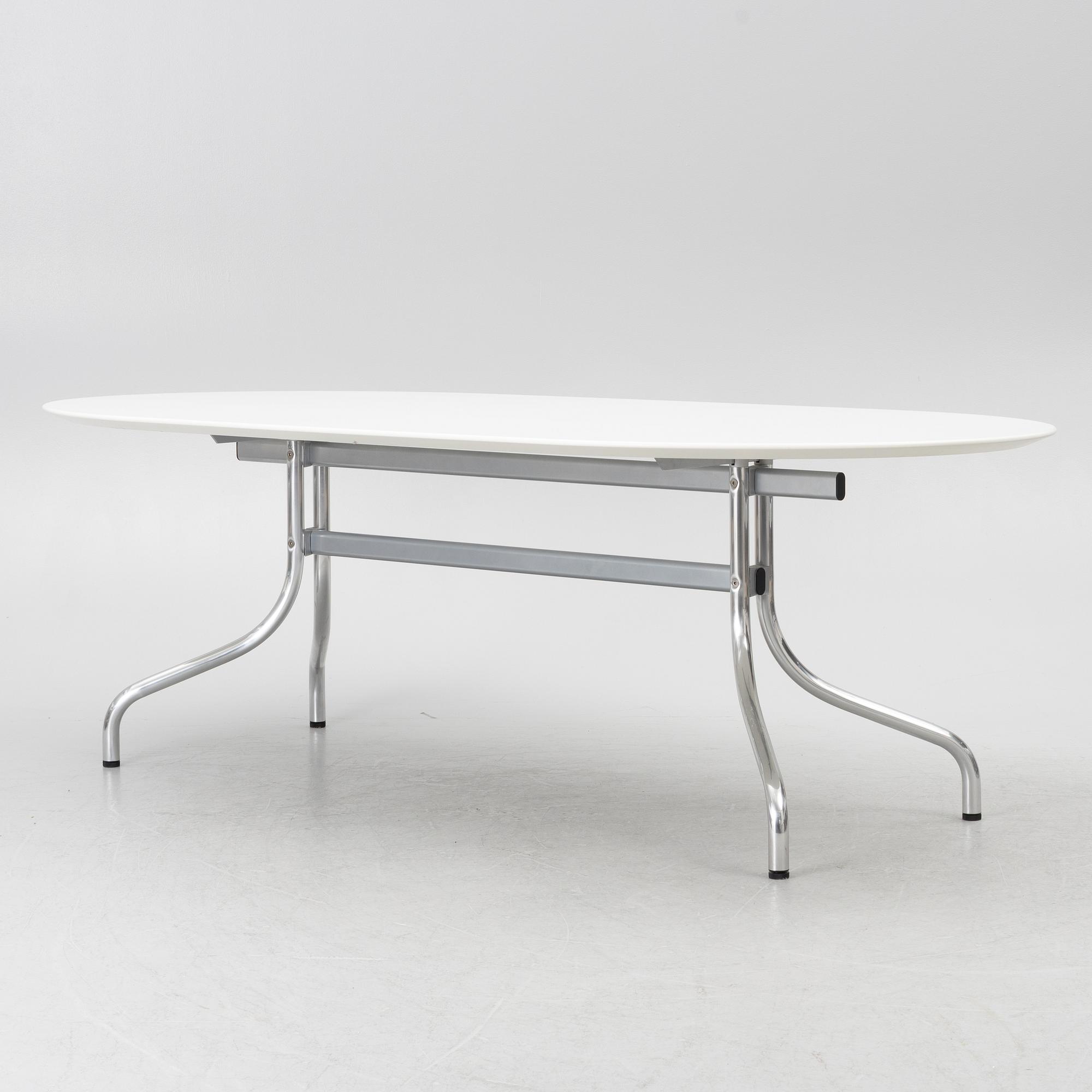 Vico Magistretti, a "Shine" dining table with twelve chairs, De Padova, Italy, around the year 2000.