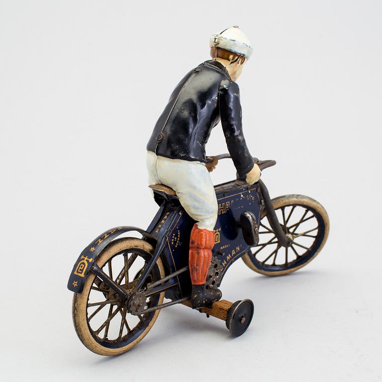 A partially hand painted tinplate Lehmann Halloh motorcycle, Germany. In production 1914-41.