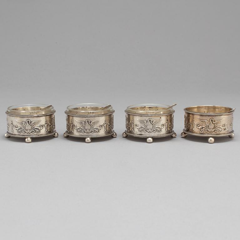 A set of four Fabergé salt-cellars and spoons, marked Moscow 1908-1917. Imperial Warrant.