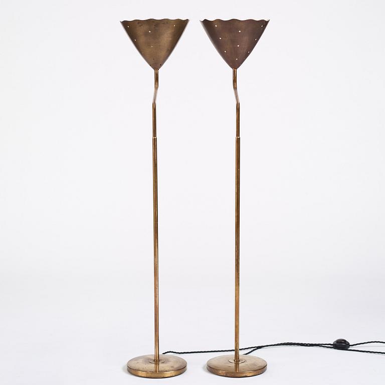 A pair of Swedish Modern brass uplights, 1940's.