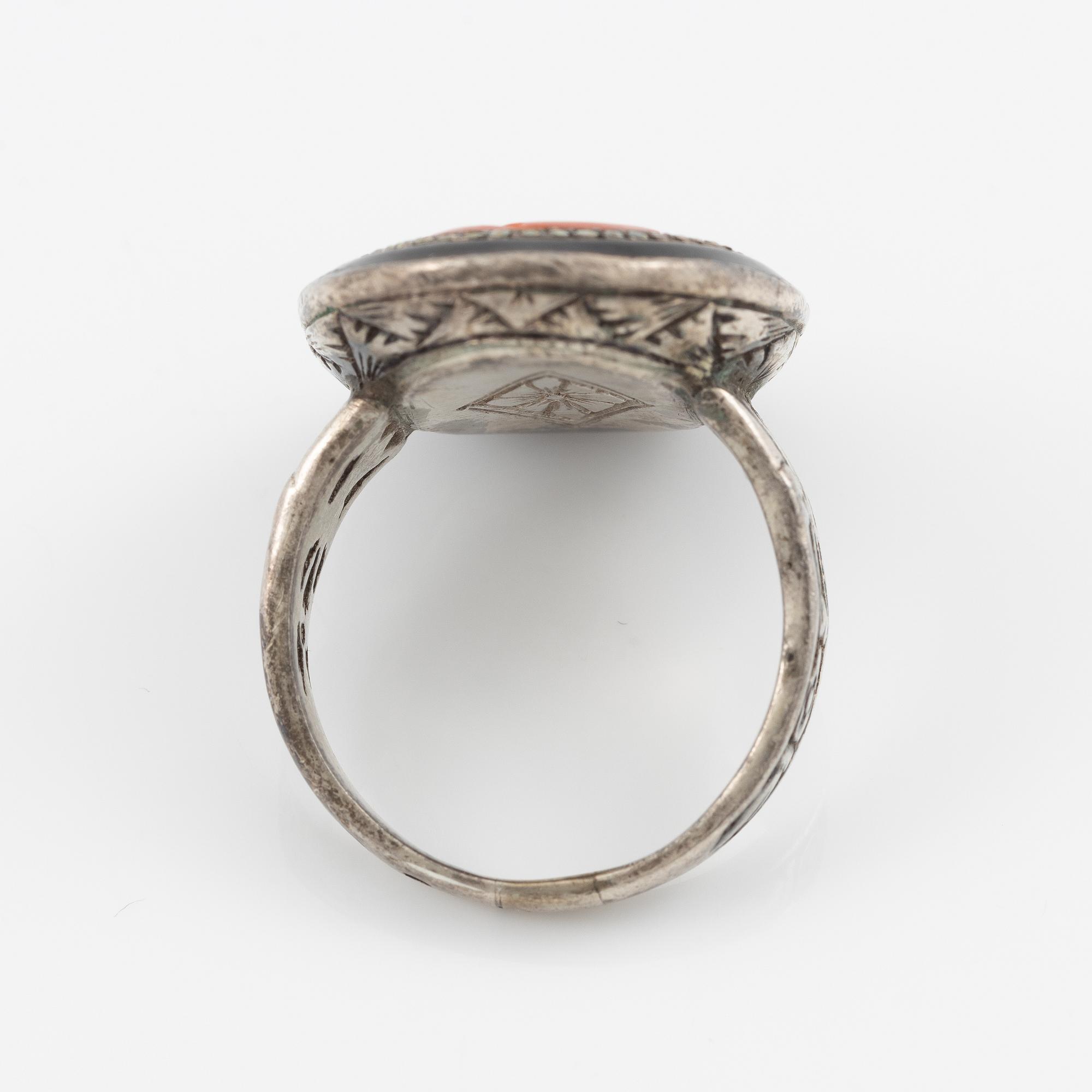Silver ring with coral and marcasites and with black details.