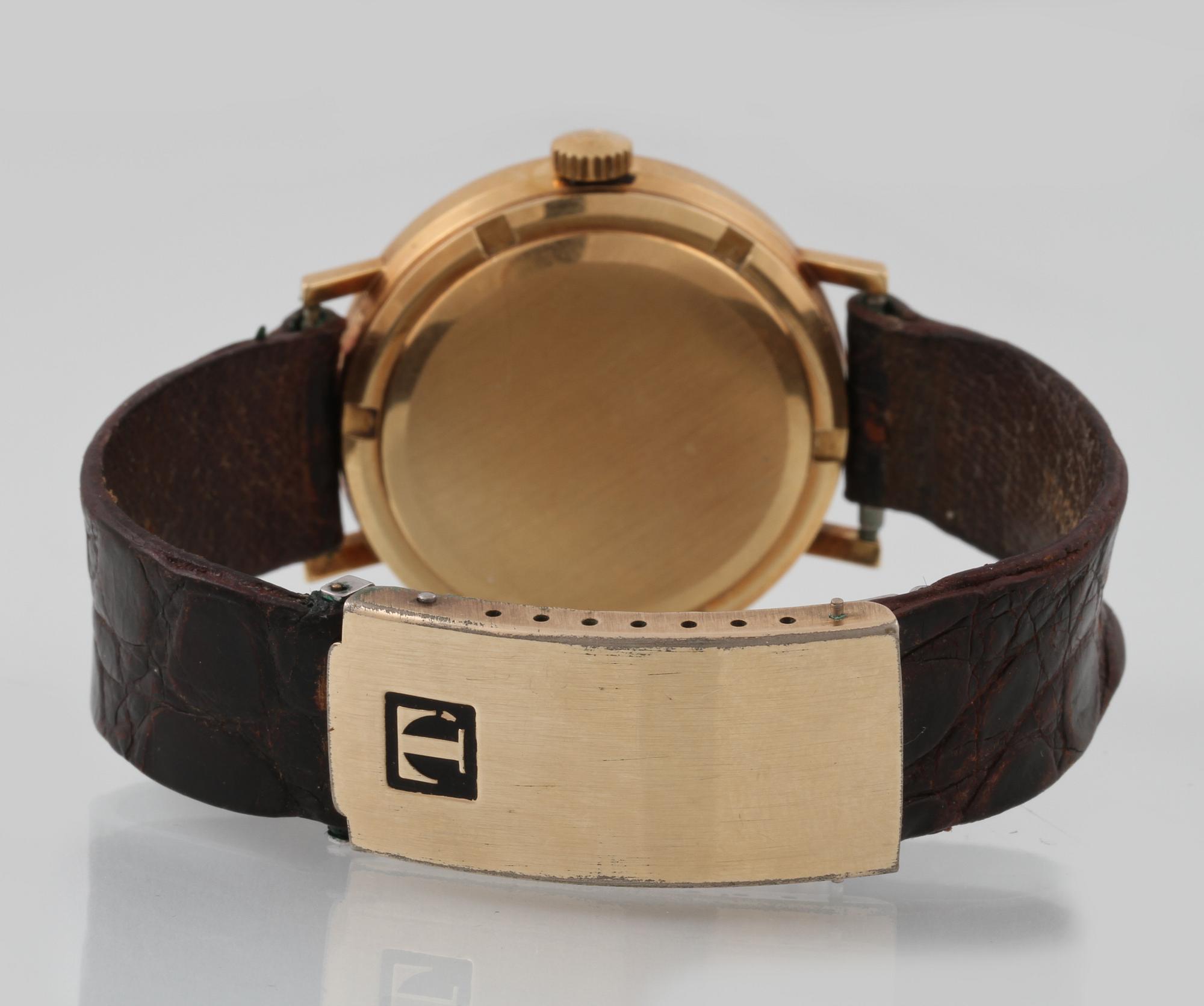 ARMBANDSUR, 18 k guld, Tissot, "seastar".