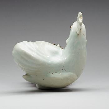 A white glazed figure of a rooster, Qing dynasty (1644-1912).