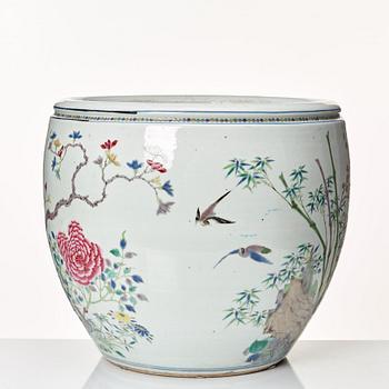 A large famille rose fish bowl, late Qing dynasty, circa 1900.