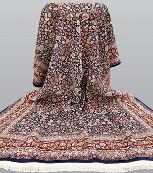 A signed Hereke carpet, ca 340 x 246 cm.