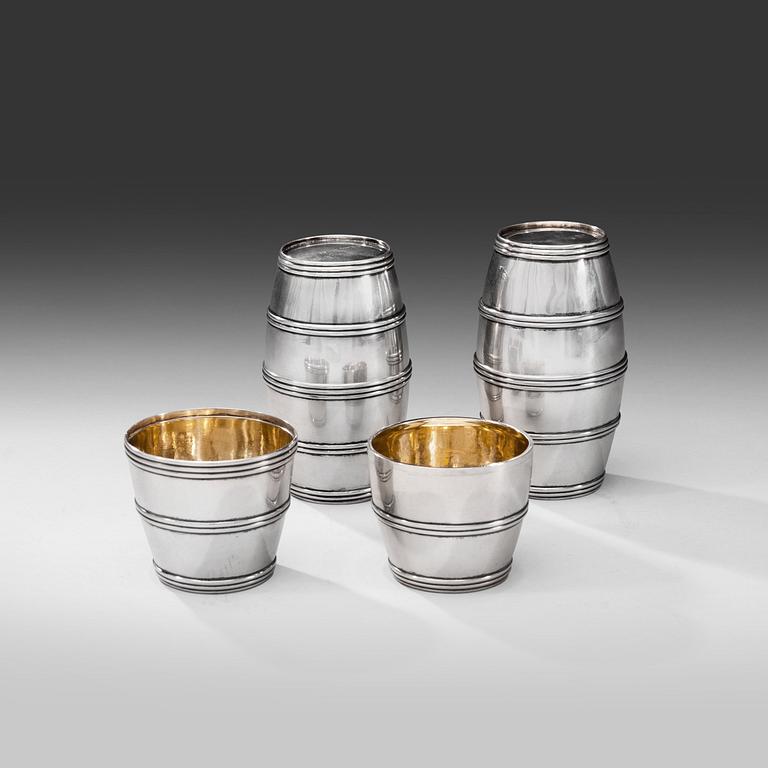 A SET OF THREE BARREL BEAKERS.