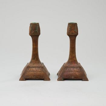 A pair of G Backlund & Hugo Elmqvist Art Nouveau patinated bronze candlesticks, AB Hugo Emlqvist, Stockholm.