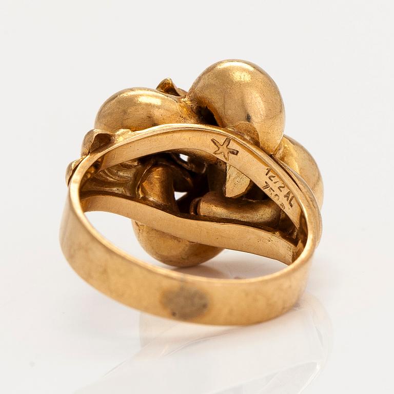 An 18K gold ring. Foreign hallmarks.