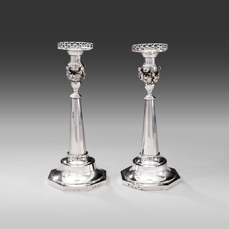 A PAIR OF EMPIRE CANDLESTICKS.