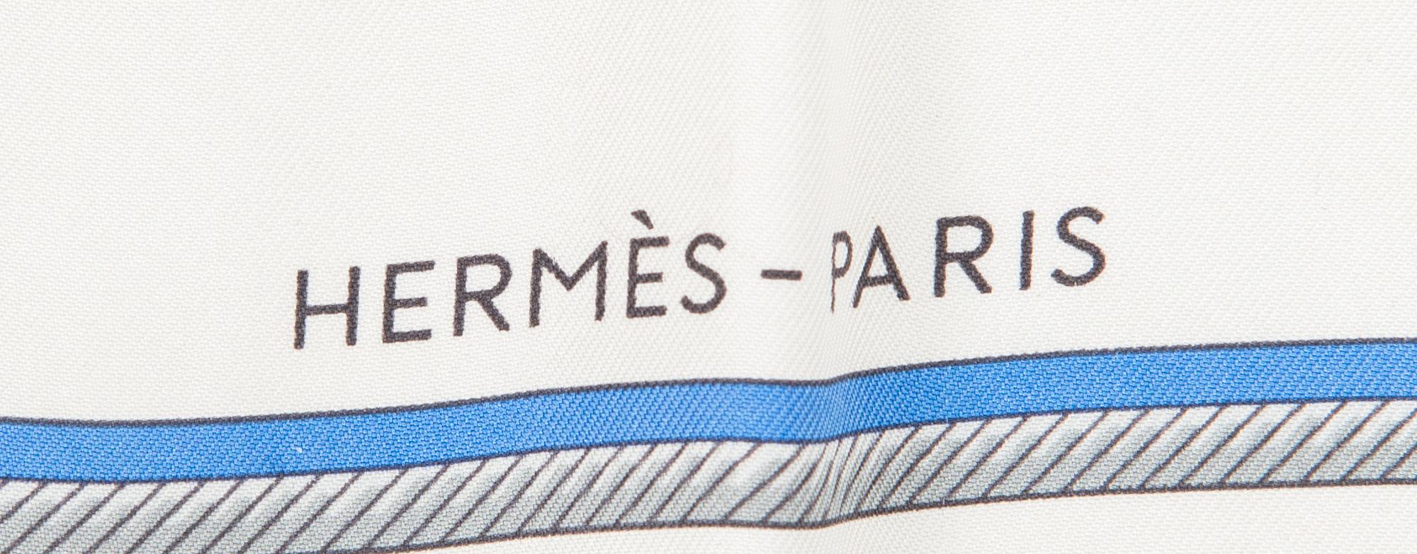 Hermès, a 'Les Voitures à Transformation' silk scarf.