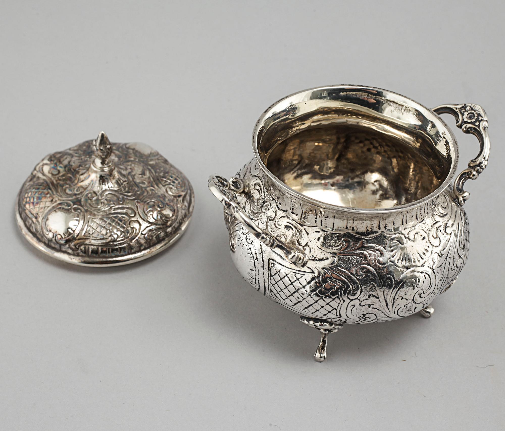 A silver sugarbowl, a cream jug and a tray by J L Hultman, Stockholm, mid 20th century.