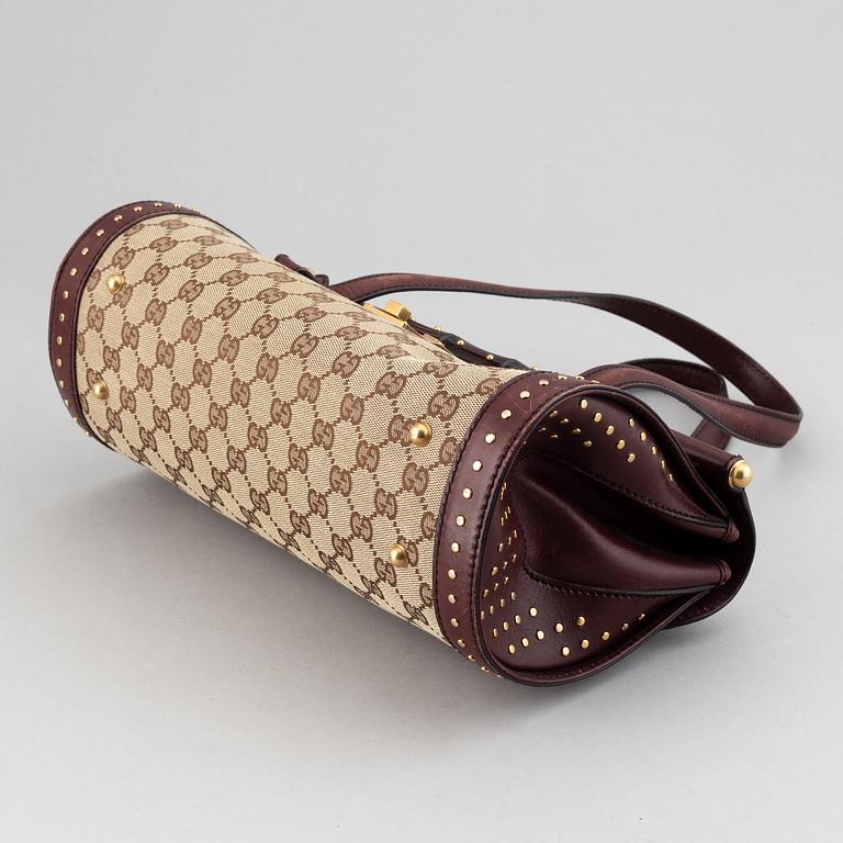 Gucci, a monogram canvas bag.