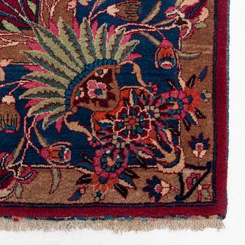 A semi-antique Mashad carpet, northeastern Persia, c. 404 x 307 cm.