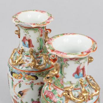 A pair of famille rose Canton table lamps and a pair of vases, late Qing dynasty, 19th Century.