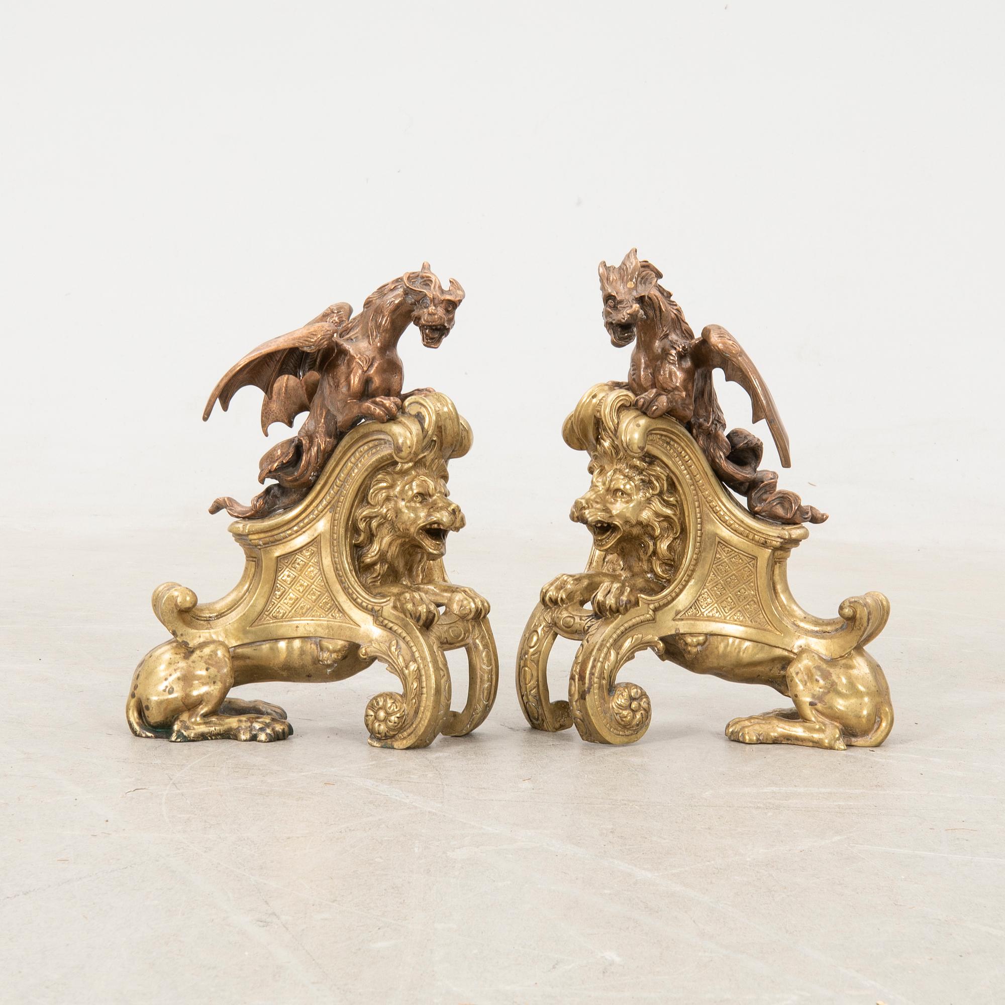 Fire dogs a pair of Baroque style 20th century in the manner of Charles Cressent.