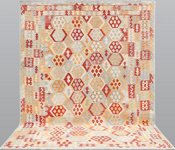 A kilim carpet, ca 340 x 259 cm.