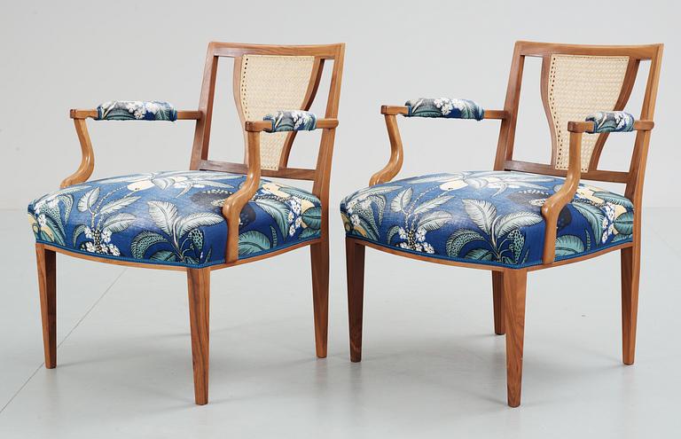 A pair of Josef Frank mahogany and ratten armchairs, Svenskt Tenn,