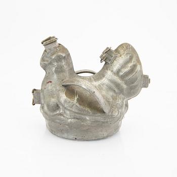A set of four pewter icecream moulds around 1900.