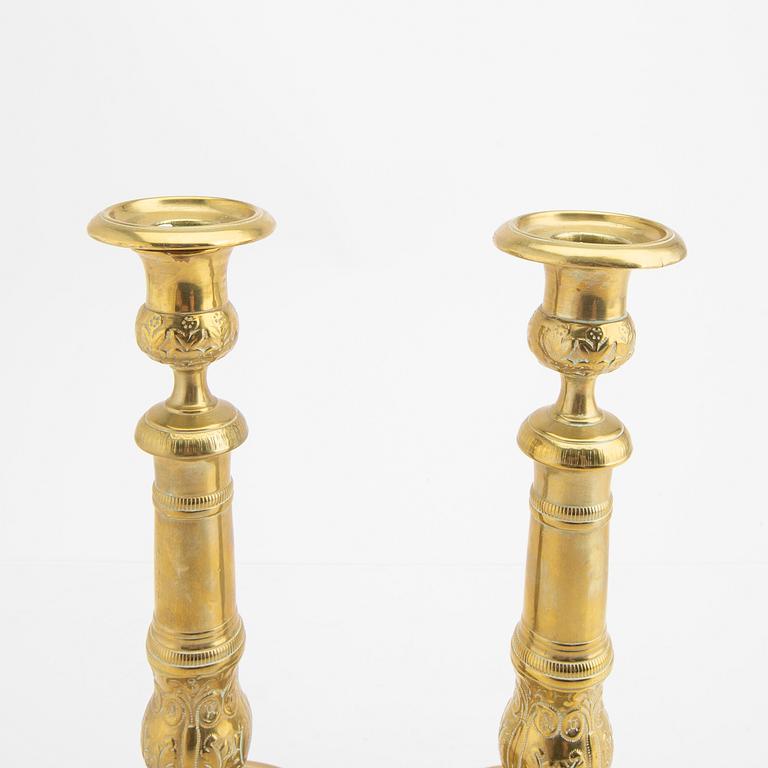 A pair of 19th century brass candle sticks.