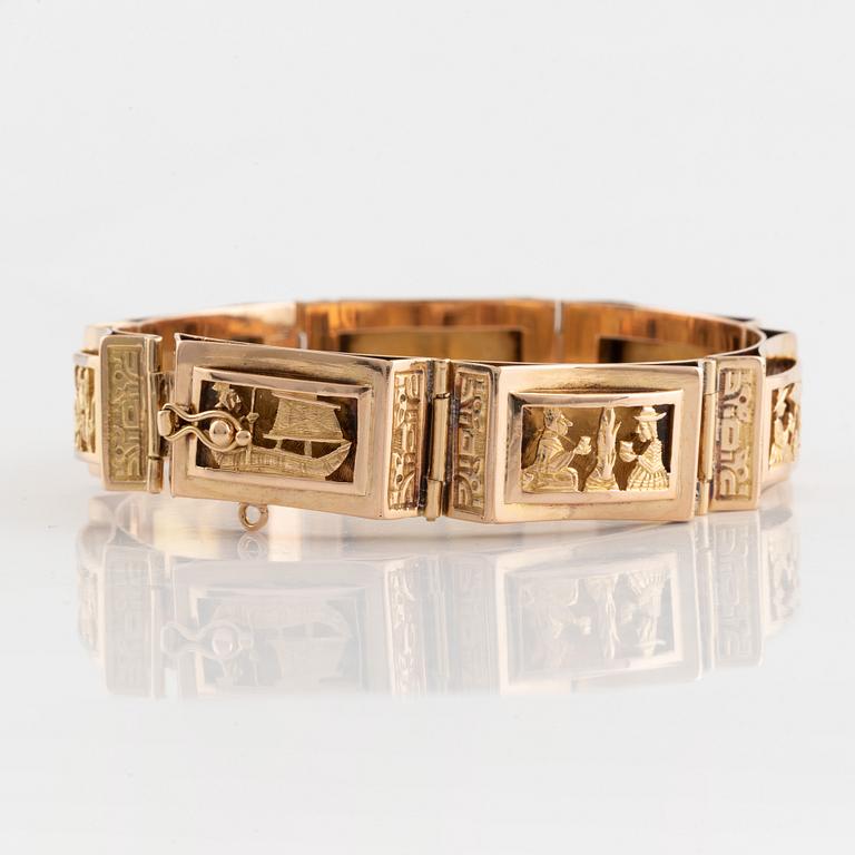 Gold panel bracelet.