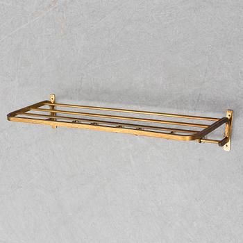 A 20th century brass cloth rack/hanger.