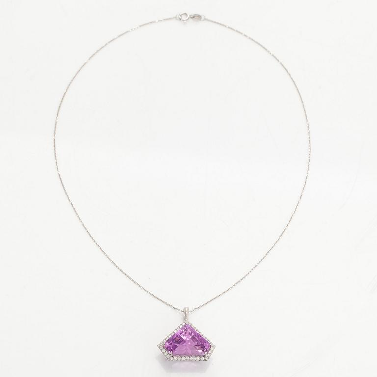 A 14K gold necklace with kunzite and brilliant cut diamonds.