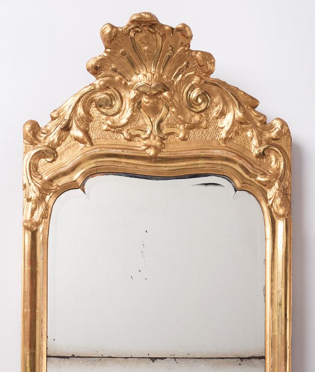 A Swedish Rococo mirror by E Göbel (master in Stockholm 1744-64), dated 1757.