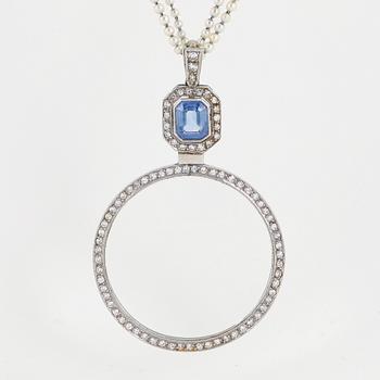 A platinum lorgnette set with a faceted sapphire and rose-cut diamonds.