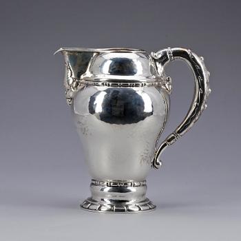 KANNA, silver, kontrollstämplad av Christian F. Heise, Köpenhamn 1916. Vikt ca 440 gram.