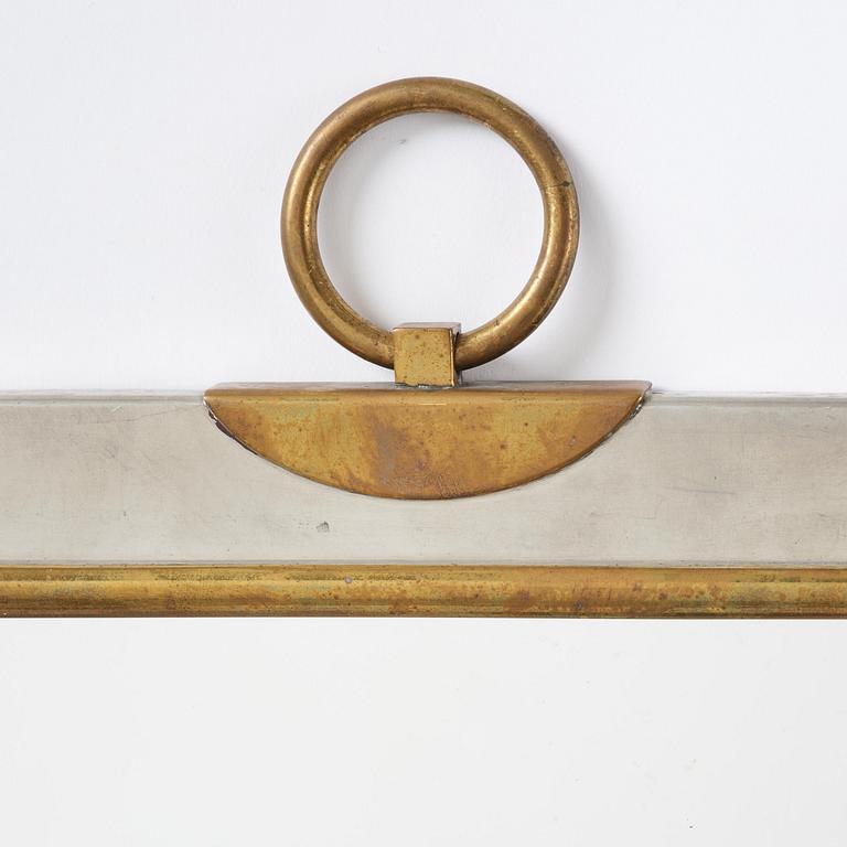 Firma Svenskt Tenn, a pewter and brass wall mirror model 2283, Firma Svenskt Tenn, Stockholm, 1952.