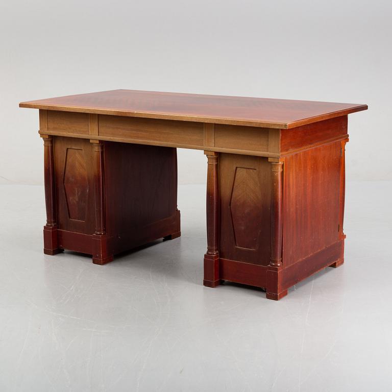 An Empire style writing desk, first half of/mid 20th century, and an Empire style chair, early 20th century.