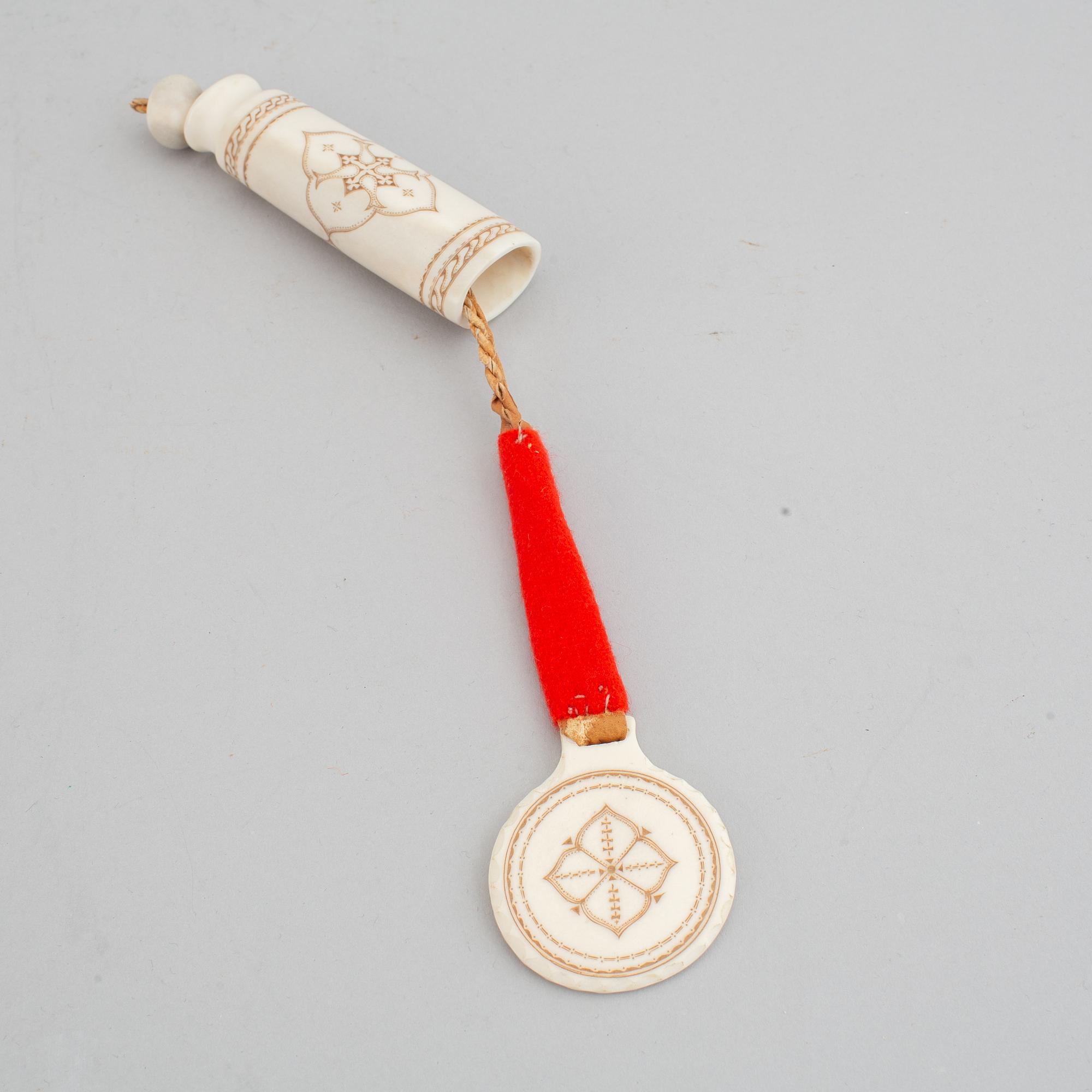 Four Sami pendants, reindeer horn, birch and embroidery with silver thread, one signed TF for Torsten Fankki.