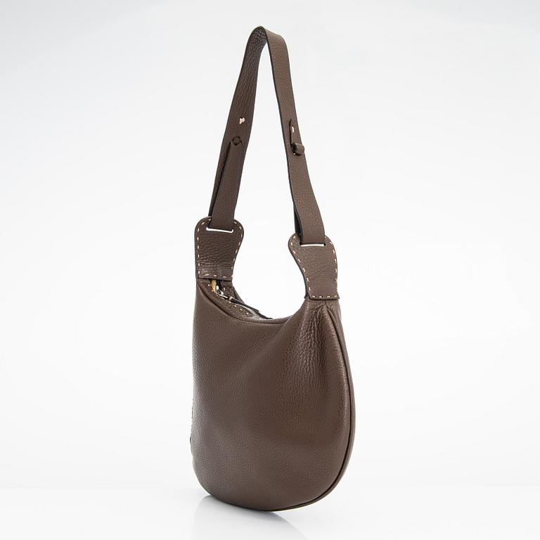 Fendi, a brown leather bag.