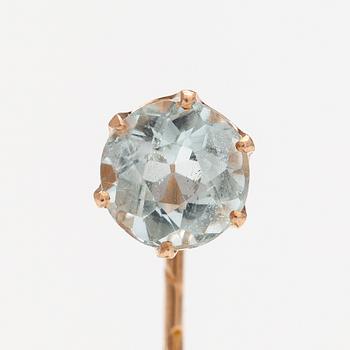 A 14K gold tiepin with a aquamarine.