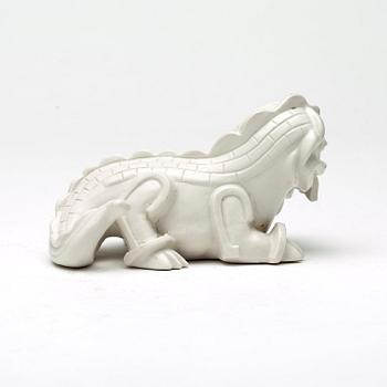 Wilhelm Kåge, a set of stoneware figures of a 'dragon puppy' and two 'dragon puppies' with candle holders, Gustavsberg, ca 1940.