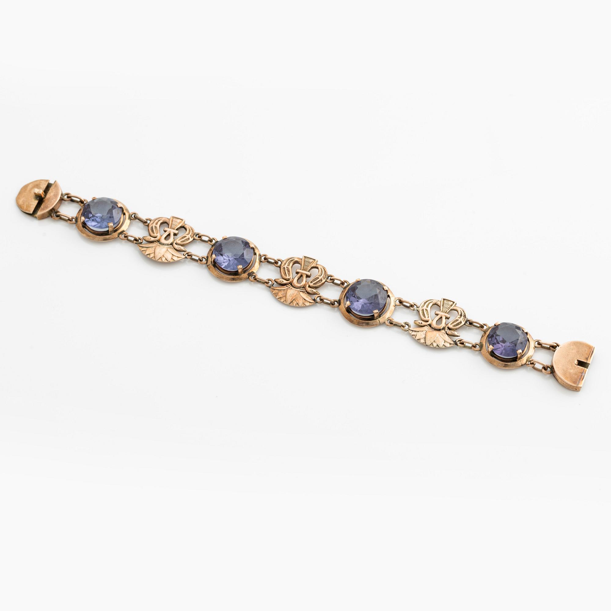Bracelet and ring with color-changing synthetic stones.