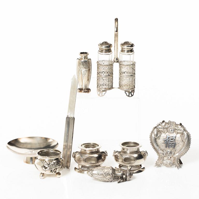 A group of salts and miniatures, part Japanese and Chinese, part silver, around 1900.