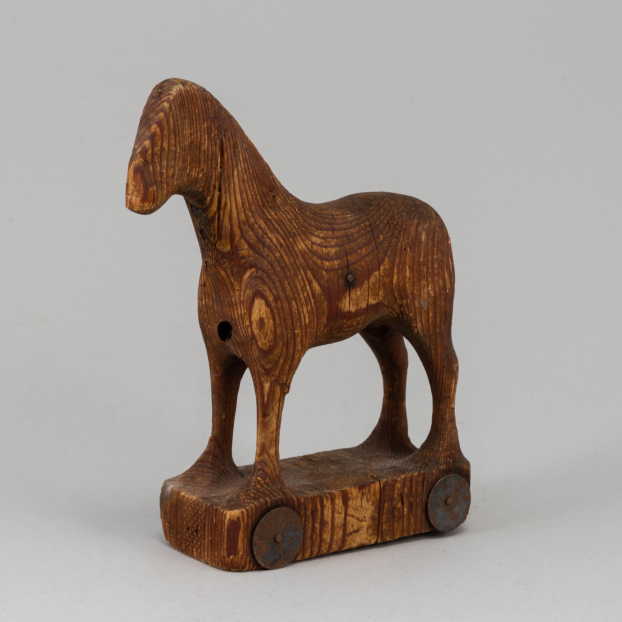 A wooden toy horse, marked Berglinds Leksaksfabr, Nyköping, early 20th century.