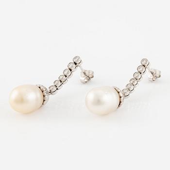 A pair of earrings in 18K white gold with cultured South Sea pearls and round brilliant-cut diamonds.