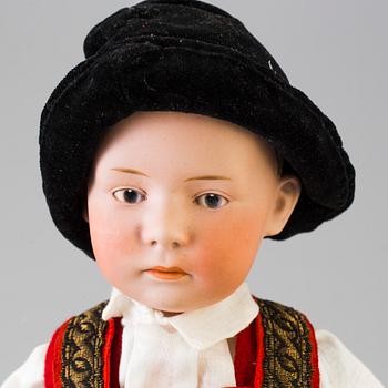 A bisque headed boy doll by Heubach, Germany, 1910s.