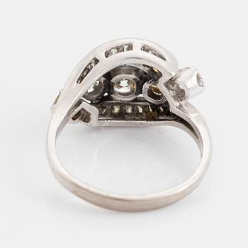 Platinum, brilliant and baguette cut diamond ring.