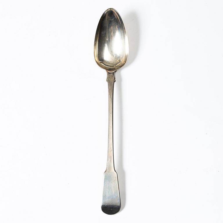 An English silver serving spoon, London 1815.