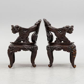 A pair of Chinese hardwood chairs, 20th century.