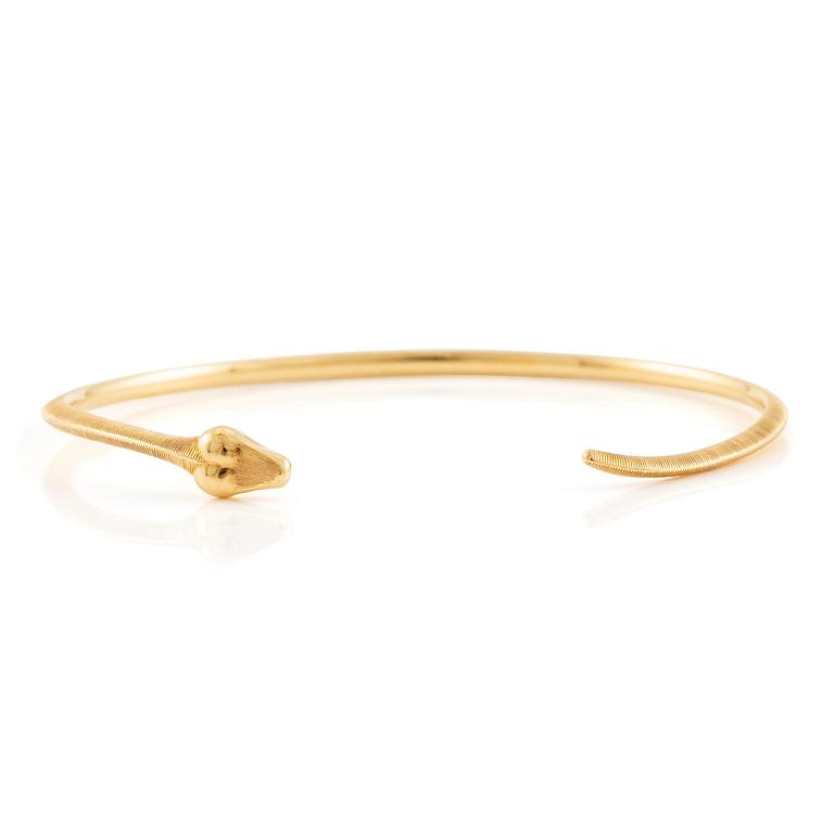 An Ole Lynggaard bracelet 18K gold in the shape of a snake.